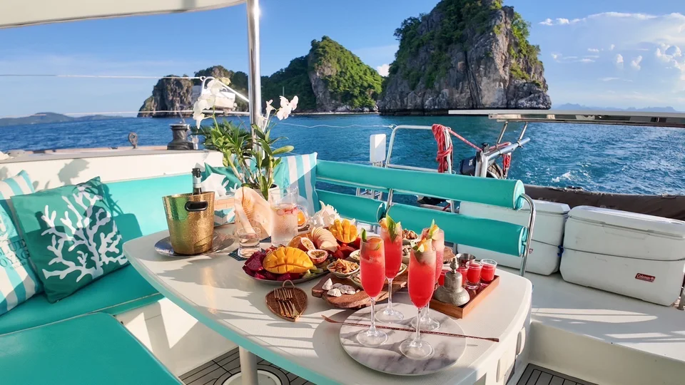 A dining table set on the yacht with an open view of the water